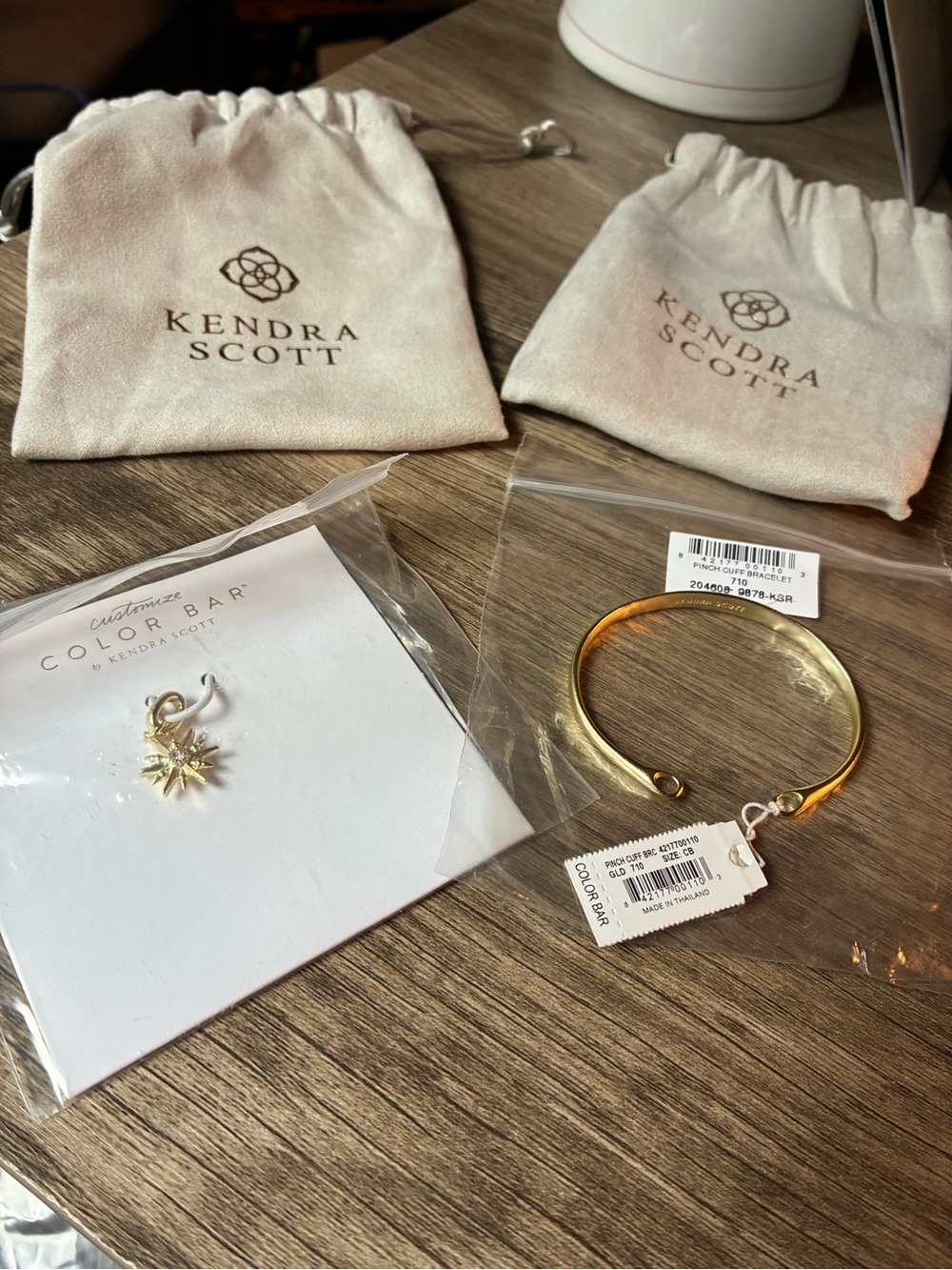 Kendra Scott Gold Pinch Cuff Bracelet with Sunburst Charm